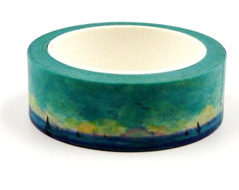 May include: A roll of decorative washi tape with a watercolour landscape design. The tape has a teal and blue gradient with a yellow and blue horizon line, and a white interior.