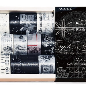 May include: A set of six black and white washi tapes in a white box with a black and white patterned box lid. The lid has the text "Black and White Poets Society" and "Retro Imprint Series".