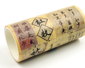 May include: A roll of decorative washi tape with a vintage aesthetic. The tape features a cream-coloured background with faded text and illustrations in black and red. The tape is ideal for scrapbooking and crafts.