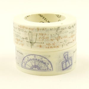 May include: Two stacked rolls of off-white washi tape. The top roll features brown mathematical equations and a coordinate plane graph. The bottom roll displays blue illustrations of a protractor and a binder clip with the text good study.