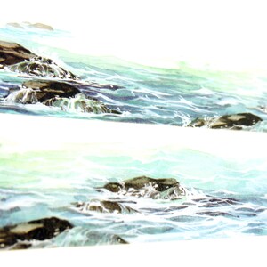 May include: A watercolor painting of a seascape with dark brown rocks and white foamy waves. The water is a light blue and green color.