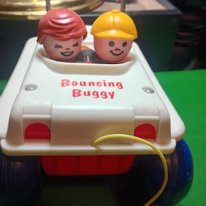 May include: A set of three ceramic mugs with a speckled, matte finish. The mugs are in shades of cream, light gray, and dark gray. Each mug has a simple, minimalist design and a rounded handle.