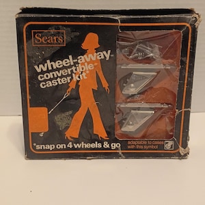 May include: Vintage Sears Wheel-Away convertible caster kit in its original box. The box is black with orange and white text and graphics, including a silhouette of a person. The kit includes casters and hardware.