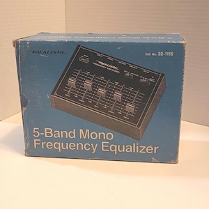 May include: A vintage Realistic 5-Band Mono Frequency Equalizer in its original box. The box is blue with the product name and brand name printed in white. The equalizer is black with five sliders.