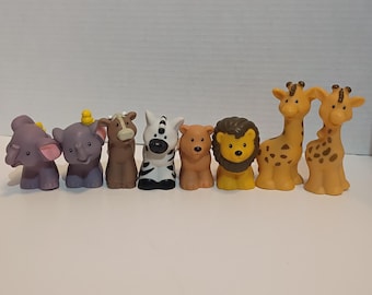 2007 Fisher-Price Little People plastic animal figures, including giraffes, elephants, a lion, a bear, a zebra, and a cow