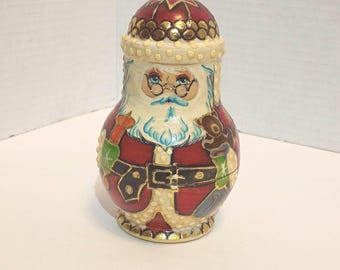4-piece hand-carved and hand-painted wooden Russian Nesting Doll set featuring holiday figures.