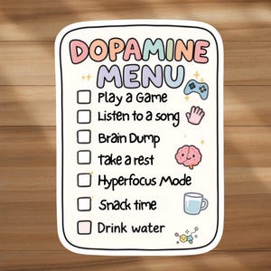 May include: A white sticker with a colorful "Dopamine Menu" design. The menu includes options like "Play a Game," "Listen to a song," and "Drink water." The sticker features cute illustrations of a game controller, a hand, a brain, and a water cup.