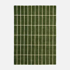 May include: A rectangular green rug with a repeating pattern of vertical green rectangles separated by thin, off-white lines. The rug has a soft, textured appearance and a simple, modern design.