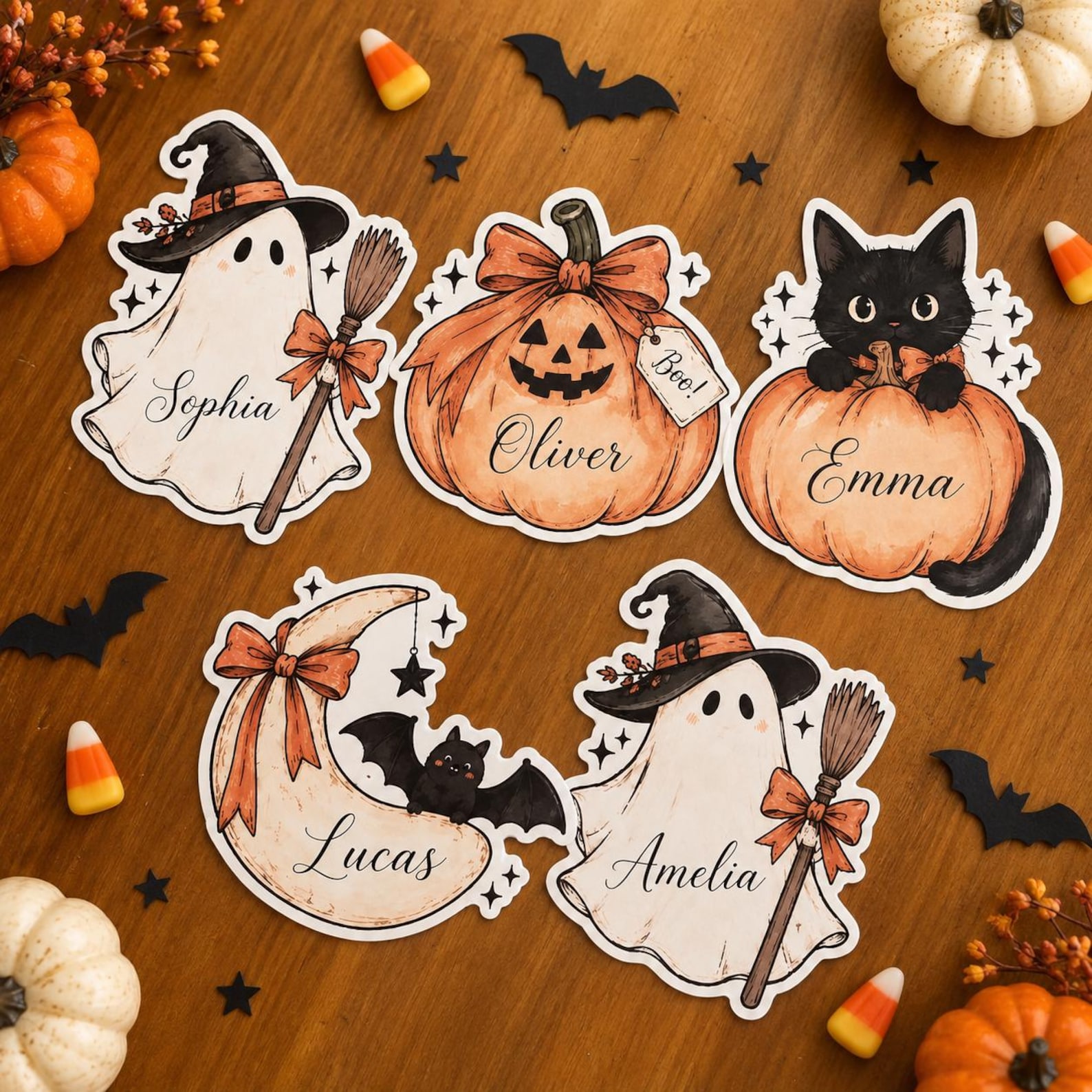 A Glossy Character Cutout at Each Seat Personalized ghost, pumpkin, cat and bat die-cut Halloween place cards.
