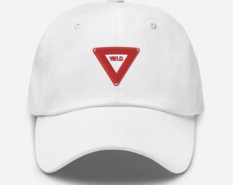 May include: White baseball cap with a red yield sign embroidered on the front.
