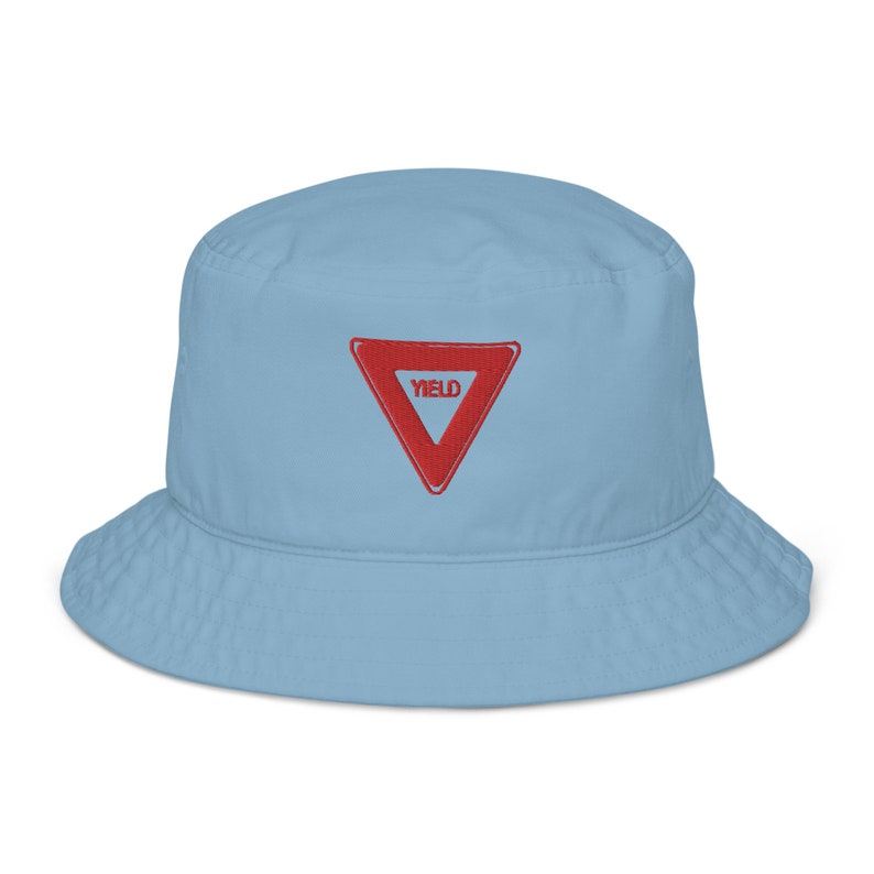 May include: A light blue bucket hat with a red yield sign embroidered on the front.