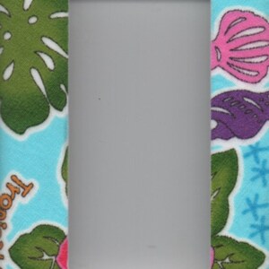 May include: A light blue light switch cover with a colorful Hawaiian themed design. The design features the word "Aloha" in rainbow colors, tropical flowers, and leaves.