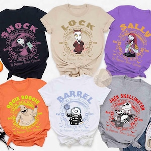 May include: Collection of six t-shirts featuring characters from "The Nightmare Before Christmas." Designs include "Shock," "Lock," "Sally," "Oogie Boogie," "Barrel," and "Jack Skellington." Each shirt has a unique graphic and text, with the year 1993.