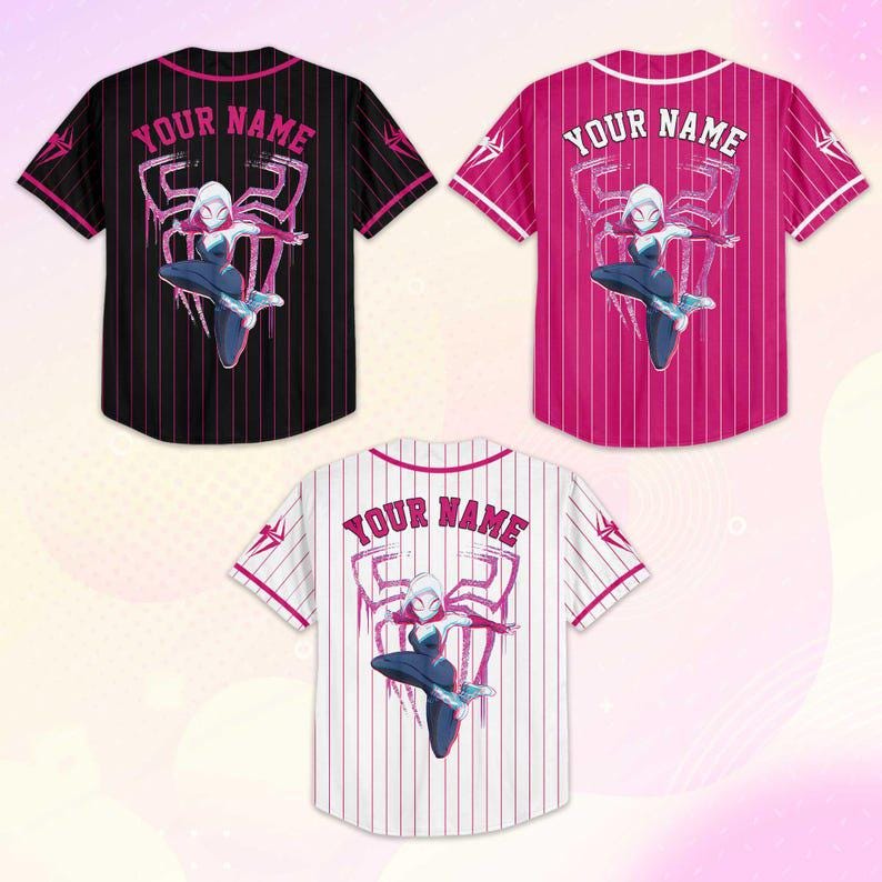 May include: Three baseball jerseys with a superhero theme. One is black with pink pinstripes, another is pink with white pinstripes, and the third is white with pink pinstripes. Each jersey features a character graphic and the text "YOUR NAME".