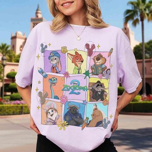Puede incluir: Una camiseta de color lila claro con un gr&aacute;fico colorido de personajes de la pel&iacute;cula "Zootopia 2". El dise&ntilde;o incluye im&aacute;genes de dibujos animados de un conejo, un zorro y otros animales, con el t&iacute;tulo de la pel&iacute;cula en un lugar destacado.