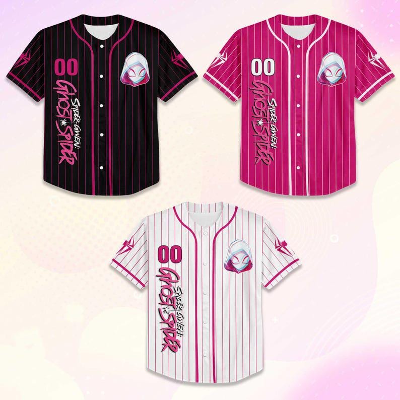 May include: Three baseball jerseys in black, pink, and white, each featuring a Ghost Spider design. The jerseys have the number "00" and the text "SPIDER-GWEN GHOST SPIDER" printed on them. The black jersey has pink pinstripes, the pink jersey has white pinstripes, and the white jersey has pink pinstripes.