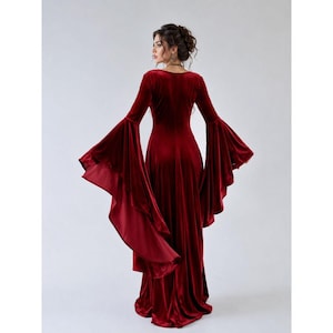 Elegant crimson velvet medieval dress for women featuring a fitted bodice and wide flowing hem
