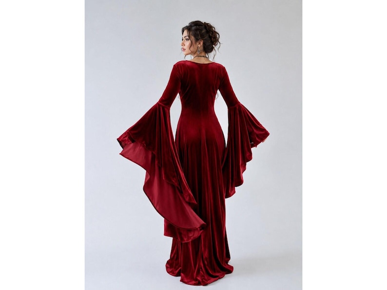 Elegant crimson velvet medieval dress for women featuring a fitted bodice and wide flowing hem