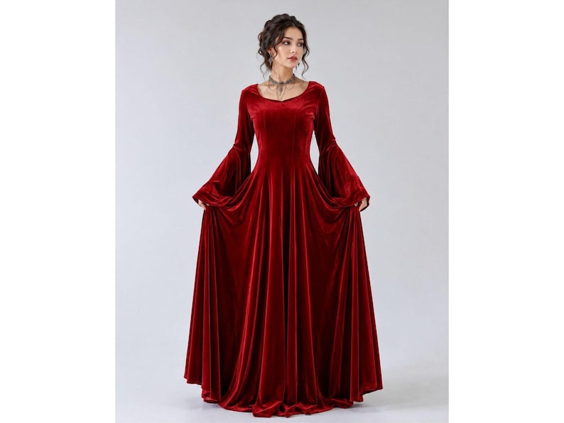 Gothic renaissance inspired red velvet gown with long bell sleeves and full floor-length skirt