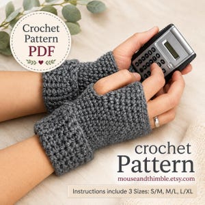 May include: A pair of dark gray fingerless gloves with a textured crochet stitch pattern. The gloves feature a folded cuff design and a thumb opening. The image includes text stating Crochet Pattern PDF and Instructions include 3 Sizes: S/M, M/L, L/XL.