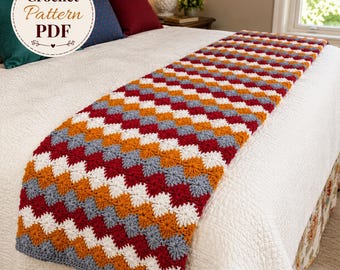 May include: A rectangular crochet bed runner featuring a repeating geometric pattern in alternating rows of dark red, white, orange, and grey yarn. The text Crochet Pattern PDF is visible in the upper left corner, and mouseandthimble.etsy.com is at the bottom.