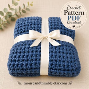 May include: A folded dark blue crochet blanket tied with a cream-colored satin ribbon bow. A circular label in the upper right corner reads Crochet Pattern PDF Download. The text mouseandthimble.etsy.com is printed at the bottom.