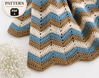 May include: A crochet pattern PDF featuring a chevron design in alternating stripes of blue, cream, and brown. The text on the circular badge reads Crochet PATTERN PDF. The blanket has a textured stitch pattern with a scalloped edge finish.