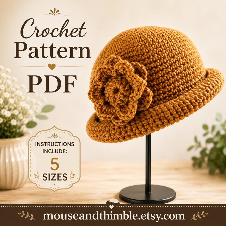 May include: A mustard-colored crochet hat with a large, layered flower accent on the side, displayed on a black stand. The image includes text reading Crochet Pattern PDF and Instructions Include: 5 Sizes, with the URL mouseandthimble.etsy.com.