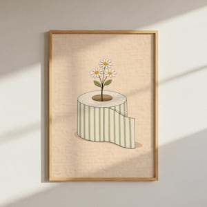 May include: A framed art print featuring a whimsical illustration. A roll of toilet paper with green and white stripes has a plant with three daisies growing from the center. The background is a light beige color.