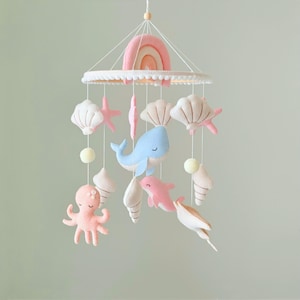 May include: A white ceramic mug with a black handle and the text "But First, Coffee" in a handwritten style. The mug is on a white surface. The mug is 4 inches tall.