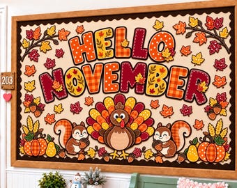 May include: A rectangular bulletin board with a wooden frame featuring the text HELLO NOVEMBER in large, colorful, patterned letters. The board is decorated with illustrations of a turkey, two squirrels, pumpkins, pears, and autumn leaves.
