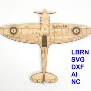 May include: A wooden model of a Spitfire Mk I airplane, viewed from above. The model is light brown with engraved details, including the wingspan, propeller, and roundels. The text "Spitfire Mk I" and "1:48" are visible. The image also includes the text "LBRN SVG DXF AI NC".