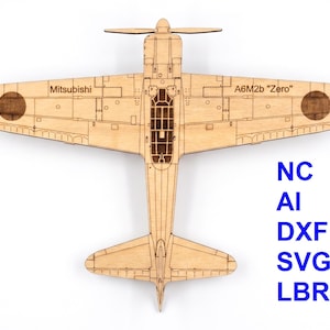 May include: A laser-cut wooden model of a Mitsubishi A6M2b Zero airplane, viewed from above. The light-colored wood features engraved details, including wings, a cockpit, and a propeller. Blue text on the right lists file formats: NC, AI, DXF, SVG, LBRN.