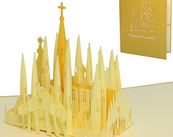 Puede incluir: Una tarjeta pop-up 3D amarilla que representa la basílica de la Sagrada Familia en Barcelona, España. La tarjeta está abierta y la basílica se muestra en detalle. La tarjeta está hecha de papel y tiene un acabado dorado.