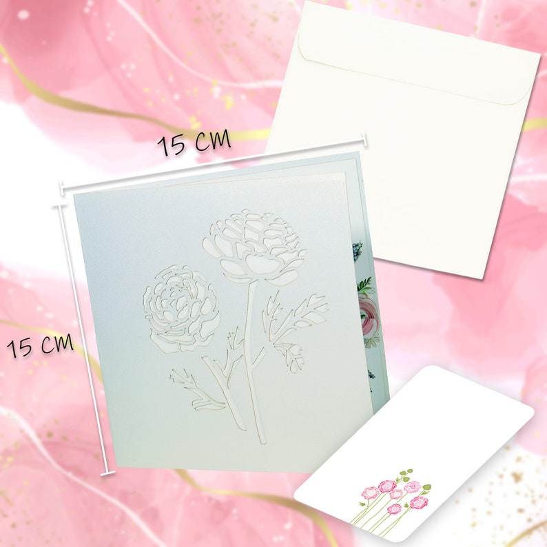 May include: A light blue greeting card with a floral design, measuring 15 cm x 15 cm, accompanied by a white envelope and a smaller card with pink flower illustrations. The card features a cut-out of two flowers.