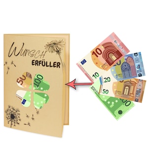 May include: A brown card with the text "Wunsch Erf&uuml;ller" and a four-leaf clover with euro bills peeking through the holes. The card is next to a stack of euro bills.