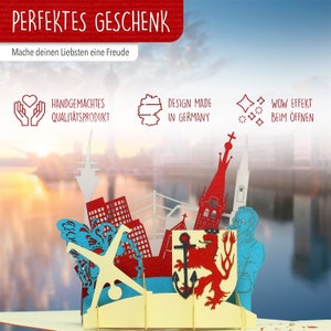 May include: A red, white, and blue 3D pop-up card depicting a cityscape with a red lion, an anchor, and a church steeple. The card is made in Germany and has a wow effect when opened.