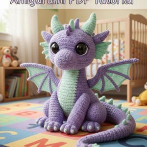 May include: Crocheted purple dragon with green accents, including wings, horns, and belly. The dragon has large black eyes and is sitting on a colorful alphabet rug. The image includes the text "Crochet Pattern - Amigurumi PDF Tutorial."