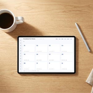 May include: A tablet displaying a digital monthly calendar titled The Android-First Planner, featuring a grid layout with numbered days from 01 to 12. The screen shows a clean interface with navigation menus at the top and a sidebar on the left side.