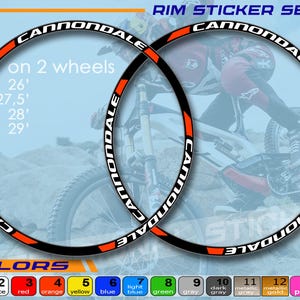 Könnte beinhalten: Cannondale Felgenaufkleber-Set mit schwarzen, weißen und orangefarbenen Akzenten. Geeignet für 26", 27,5", 28" und 29" Räder. Merkmale sind Sonnenbeständigkeit, Wasserdichtigkeit und deutsche Folie. Erhältlich in verschiedenen Farben.