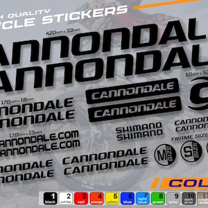 May include: Black Cannondale bicycle stickers with various sizes and designs. Includes the Cannondale logo, website address, and Shimano branding. Available in multiple colors, with sizes ranging from 170mm x 13mm to 420mm x 33mm.