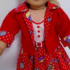 May include: A red jacket with white polka dots and a red dress with a white polka dot and colorful sweet treat print. The dress has a white top with red hearts and a rhinestone belt. The jacket has colorful sweet treat print on the cuffs.