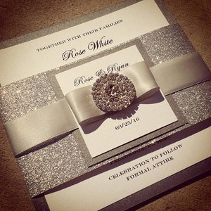 Silver and Ionized Glamorous Wedding Invitation. Sparkling Jewel Monogram.  Bling Rhinestone Sleeve band. Bilingual. USA Made