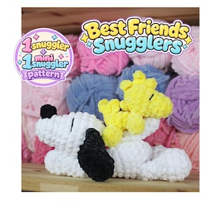 May include: A white and black crocheted dog plushie with a smaller yellow crocheted bird plushie on its back. The text Best Friends Snugglers and 1 Snuggler + 1 mini snuggler pattern appears in the image. The plushies are made of soft yarn.