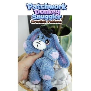 May include: A blue plush donkey toy with a white muzzle, black hair tuft, and light purple accents on the ears and feet. The text Patchwork Donkey Snuggler Crochet Pattern is displayed above the toy, which features stitched details on the face.