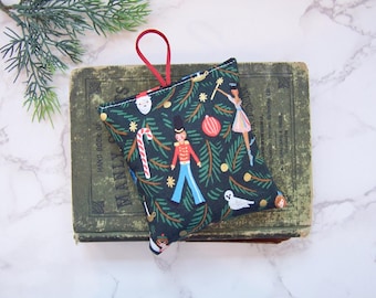 Hanging Balsam Pine sachets with the Nutcracker to hang in your bathroom or your closet .