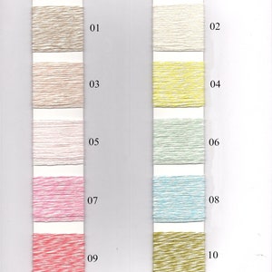 May include: Linen Cashmere yarn colour chart with ten different colours, numbered 01 through 10. The colours are beige, white, light pink, yellow, light green, light blue, pink, red, gold, and green.