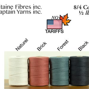 May include: Four cylindrical tubes of 8/4 cotton yarn labelled Capitaine Fibres inc. and Captain Yarns inc. The yarn colours are labelled as Naturel, Brick, Forest, and Black. The image includes a graphic of a flag and a maple leaf with the text NO TARIFFS.