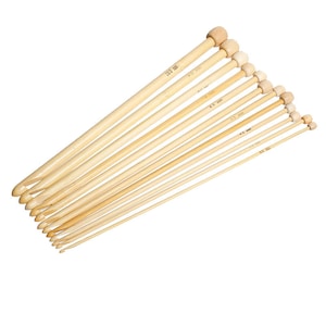 May include: A set of 10 bamboo knitting needles with wooden tips. The needles are arranged in order of size, with the largest needle at the top and the smallest needle at the bottom. The needles are all natural in color and have a smooth finish.