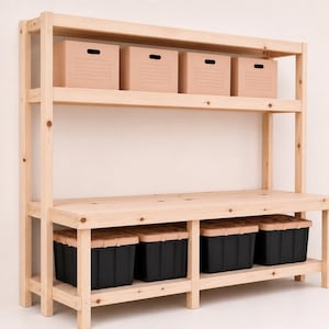 May include: A light-colored wooden storage shelf unit with multiple shelves. The top shelf holds four cardboard boxes, and the bottom shelf has four black storage bins. The unit is made of natural wood.